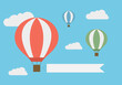 © Forgem - Flat design illustration of flying hot air balloon in the blue sky with white clouds and banner for adding your text, vector