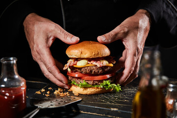 Wall Mural - Gourmet double-decker beef burger with bacon and cheese