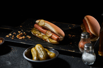 Wall Mural - Tasty hot dog with smoked frankfurter and gherkin