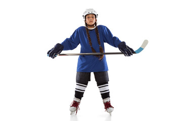 Wall Mural - Full-length portrait of chil girl hockey player isolated over ice rink