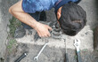 © andranik123 - Man repairs car alternator. Service center