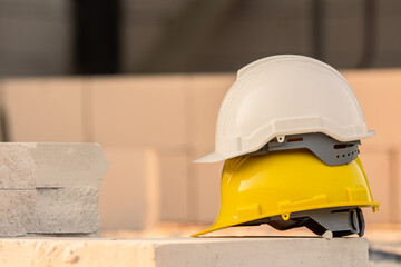 Wall Mural - Hard hat on site construction background, Helmet safety, Labor day