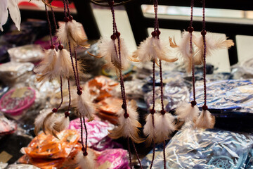 Sticker - Closeup shot of feather jewelry on the shop