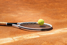 Tennis Racket And Ball On Court