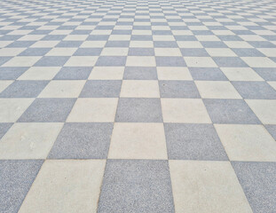 Shot of a checkered floor of the Terrazza Mascagni overlooking the sea in Livorno, Italy