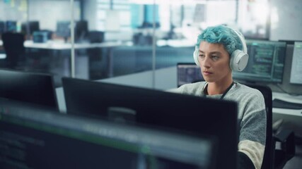 Wall Mural - In Diverse Office: Portrait of Stylish Woman in Headphones Working on Desktop Computer. Modern Digital Entrepreneur Creating Colorful e-Commerce Project Design, e-Business Social Media Strategy