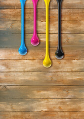 Wall Mural - cmyk ink drops on old wooden background