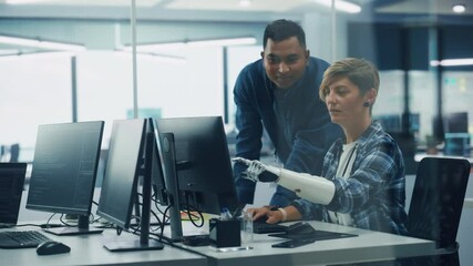 Poster - Teamwork In Diverse Inclusive Office: Project Manager Talks with Woman with Disability with Prosthetic Arm to Work on Desktop Computer. Professionals Software Engineers Create e-Commerce App Solution