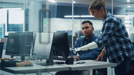 Poster - Teamwork In Diverse Inclusive Office: Project Manager with Disability points Prosthetic Arm at Screen Talks with Indian Specialist Working on Computer. Professional Creative Software Engineers