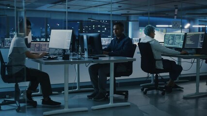Poster - Diverse Office at Night: Multi-Ethnic Team of Young Programmers Working on Desktop Computers, Screens Show Coding Language User Interface. Software Engineers Create Innovative e-Commerce App. Wide