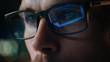 Super Close-up Portrait of Software Engineer Working on Computer, App Reflecting in Glasses. Digital Developer Working on Innovative e-Commerce Application with Machine Learning, AI, Big Data