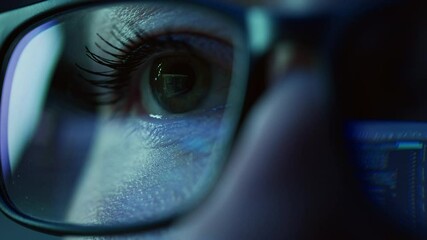 Super Close-up on Female Eye, Software Engineer Working on Computer, Programming Reflecting in Glasses. Developer Working on Innovative e-Commerce Application using Machine Learning, AI, Big Data