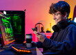 © Gabriel Trujillo - Cheerful gamer with smartphone and coffee