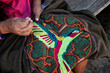 © Scopio - Cropped hand of a woman doing embroidery