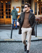 Man In Brown Zip Up Jacket Walking On Street