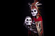 © Scopio - Person wearing skull costume holding a fake skull as part of Mexican tradition in celebrating Day of the Dead