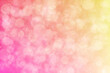Peach colored background with circle shaped bokeh. Pink to beige gradient