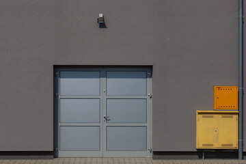 Sticker - Entrance door of a garage with grey walls