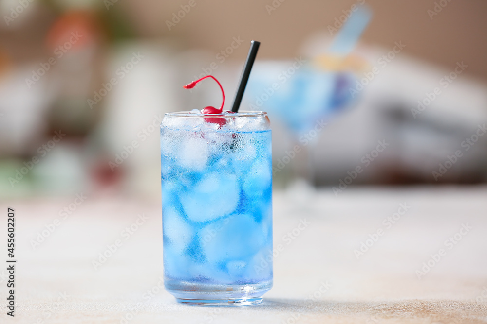 Glass of Blue Lagoon cocktail on table