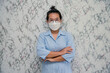 © witsanu - Woman puts on a face mask standing with crossed arms protecting from virus during quarantine isolated on White background,pandemic and social distancing concept