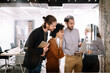 © NDABCREATIVITY - Portrait of business people, architects having discussion in office