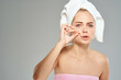 © SHOTPRIME STUDIO - woman with towel on head bare shoulders facial close-up