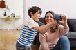 © cherryandbees - mother and child using mobile phone at home