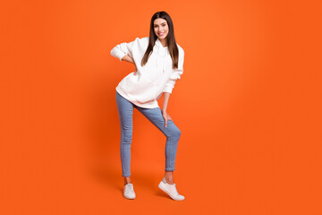 Sticker - Full length body size view of attractive cheerful thin girl posing good mood isolated over bright orange color background