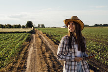 Woman Farmer Walking On Field