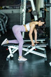 © F8  \ Suport Ukraine - Attractive woman athlete doing dumbell bench press in the gym
