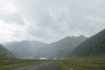 Canvas Print - Rain dropes on the car glass