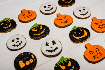Wall Mural - high angle view of homemade and tasty halloween cookies on white surface