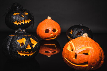 Poster - creepy orange and black pumpkins on dark background