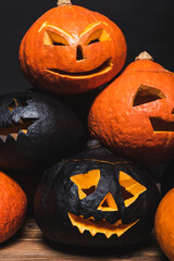 Canvas Print - stack of spooky halloween pumpkins isolated on black