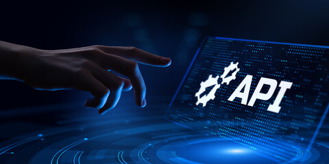 API Application Programming interface software web development concept. Hand pressing button on screen.