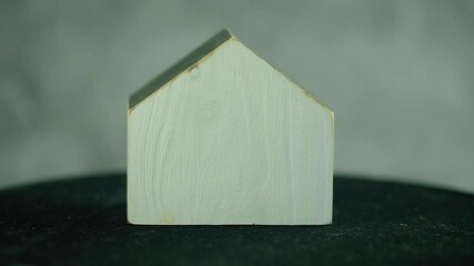 Poster - Wooden white model house rotates. Investment Properties Money and Home Ownership