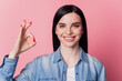 © Tetiana - Portrait of cheerful pretty girl showing okay sign alright gesture standing pleased against pink background