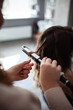 © Natalia Rzhevskaia - stylist hairdresser makes a hairstyle for a girl in his beauty salon, hollywood wave, beautiful hairstyle, hairdresser at work
