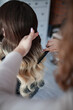 © Natalia Rzhevskaia - stylist hairdresser makes a hairstyle for a girl in his beauty salon, hollywood wave, beautiful hairstyle, hairdresser at work