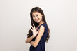 © Chanakon - Young beautiful asian woman getting a vaccine protection the coronavirus. Smiling happy female showing arm with bandage after receiving vaccination and showing ok sign.