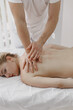 © prostooleh - Man doctor do massage to female body