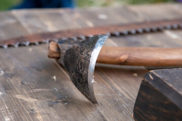 scraper metal tool carpenter on the background of the saw on the workbench of the master