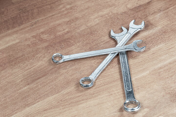 Wall Mural - set of silver metal wrenches on the master's workbench