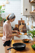 © Pietro Karras/Stocksy - Woman washing fresh mushrooms with colander