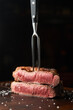 © Pietro Karras/Stocksy - Rare grilled beef steak and fork