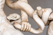 Close-up On Marble Statue Of Snake Biting A Man´s Thigh