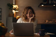 © Pietro Karras/Stocksy - Thoughtful freelancer using laptop in evening