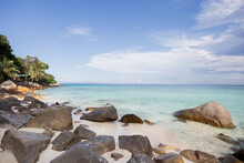 Tropical Seashore With Boulders Washed By Sea