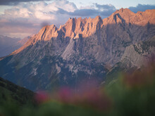 Sunrise Light On Pointy Mountain Peaks In The Alps.