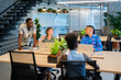 © Luis Velasco/Stocksy - Colleagues In A Coworking Workplace.